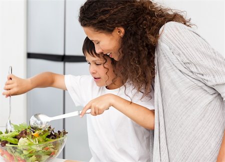 simsearch:400-04792006,k - Happy mother and son preparing a salad together in the kitchen Stock Photo - Budget Royalty-Free & Subscription, Code: 400-04281661