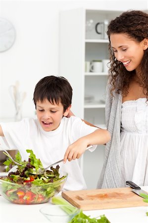 simsearch:400-04792006,k - Cute boy mixing a salad with his mother in the kitchen at home Stock Photo - Budget Royalty-Free & Subscription, Code: 400-04281662