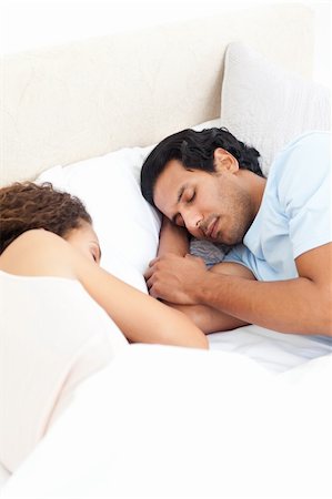 simsearch:400-05749447,k - Cute couple sleeping together in their bed during a weekend at home Stock Photo - Budget Royalty-Free & Subscription, Code: 400-04281683