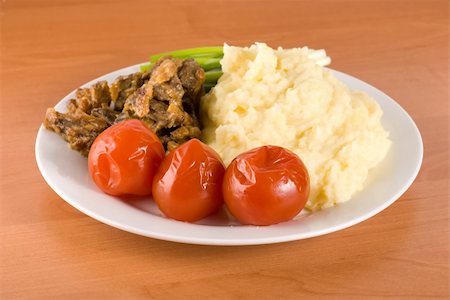 Cooked potatoes with liver and vegetables on the table Stock Photo - Budget Royalty-Free & Subscription, Code: 400-04281711