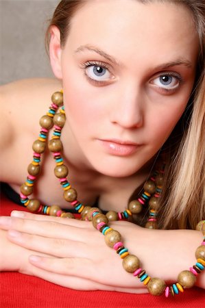 simsearch:400-04266572,k - Beautiful female model with blue eyes and a string beads Stock Photo - Budget Royalty-Free & Subscription, Code: 400-04281781