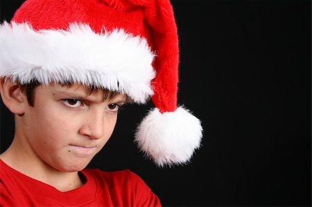 simsearch:400-05284316,k - Young boy wearing a red shirt and christmas hat Stockbilder - Microstock & Abonnement, Bildnummer: 400-04281782