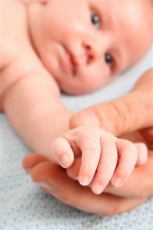 simsearch:400-04235194,k - Close up of father holding his child's hand. FOCUS on Baby Hand Stock Photo - Budget Royalty-Free & Subscription, Code: 400-04281806