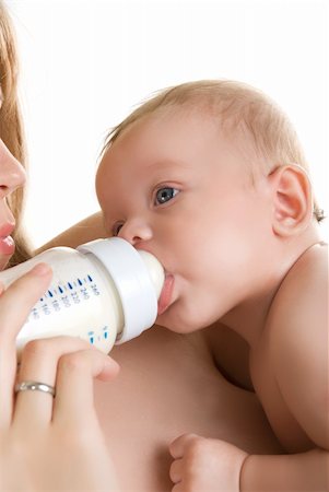 simsearch:400-04218582,k - Mother give drink her baby boy by feeding bottle Stockbilder - Microstock & Abonnement, Bildnummer: 400-04281831