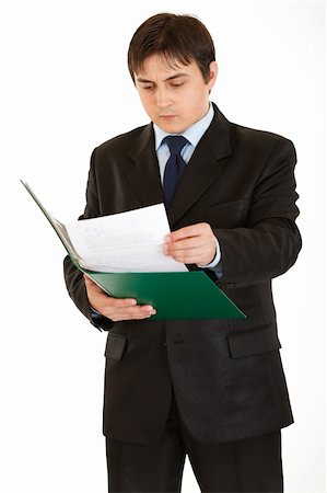 simsearch:400-05285550,k - Serious modern businessman exploring documents isolated on white Stockbilder - Microstock & Abonnement, Bildnummer: 400-04281874