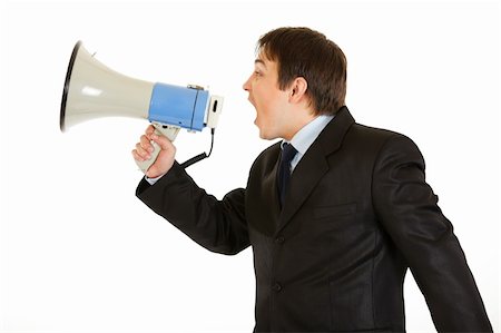 simsearch:400-05687698,k - Frustrated young businessman yelling through megaphone isolated on white Stock Photo - Budget Royalty-Free & Subscription, Code: 400-04281872