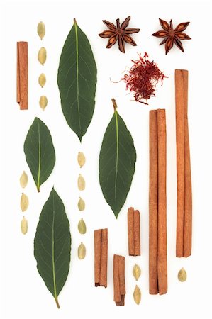 Spice and herb abstract design of saffron, cinnamon sticks, star anise, bay leaf and cardamom pods, over white background. Stock Photo - Budget Royalty-Free & Subscription, Code: 400-04282199