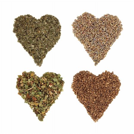 Medicinal  dried herbs of comfrey, lavender, raspberry and valerian in heart shaped piles, from top left to bottom right, over white background. Photographie de stock - Aubaine LD & Abonnement, Code: 400-04282200
