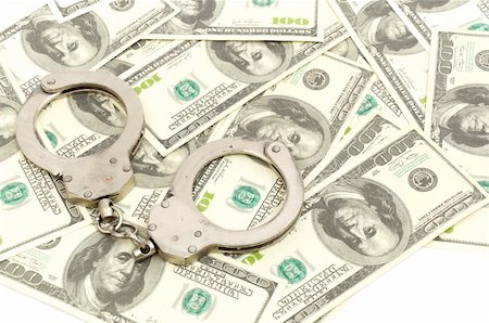 Handcuffs on money background, business security concept Stock Photo - Budget Royalty-Free & Subscription, Code: 400-04282503