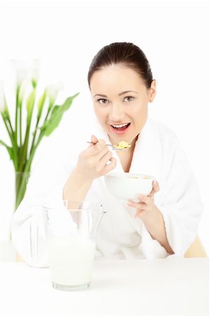 simsearch:400-08977333,k - Happy woman in bathrobe  for breakfast over white Stock Photo - Budget Royalty-Free & Subscription, Code: 400-04283202