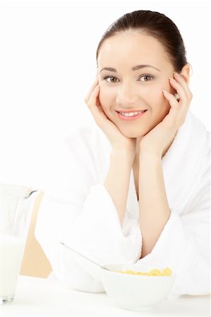 simsearch:400-08977333,k - Happy woman in bathrobe  for breakfast over white Stock Photo - Budget Royalty-Free & Subscription, Code: 400-04283203