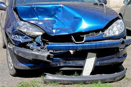 Small blue car smashed at frontal collision Stock Photo - Budget Royalty-Free & Subscription, Code: 400-04283749