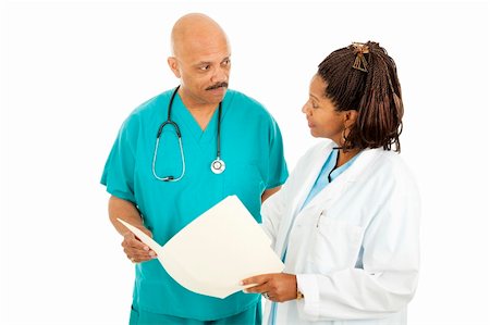 simsearch:400-05088212,k - Attractive african-american medical doctors read a patient's chart.  Isolated on white. Stock Photo - Budget Royalty-Free & Subscription, Code: 400-04294138