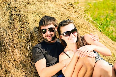 Young happy couple on the field. Shoot on the nature. Foto de stock - Super Valor sin royalties y Suscripción, Código: 400-04294195