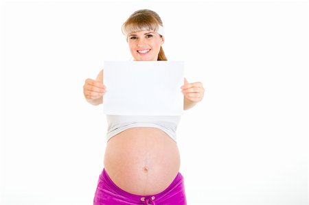 simsearch:400-04798379,k - Smiling beautiful pregnant woman holding empty white  paper isolated on white Foto de stock - Super Valor sin royalties y Suscripción, Código: 400-04294353