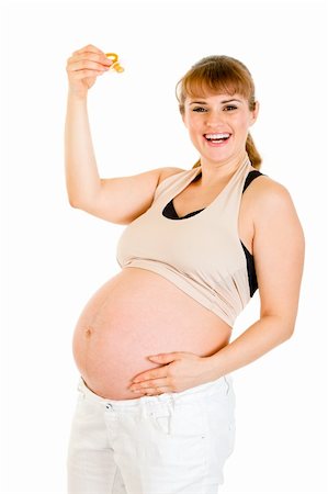 simsearch:400-04334843,k - Smiling pregnant woman holding  baby dummy Foto de stock - Royalty-Free Super Valor e Assinatura, Número: 400-04294374