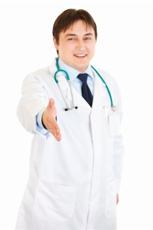 simsearch:400-04351236,k - Smiling medical doctor stretches out hand for handshake isolated on white Photographie de stock - Aubaine LD & Abonnement, Code: 400-04294402