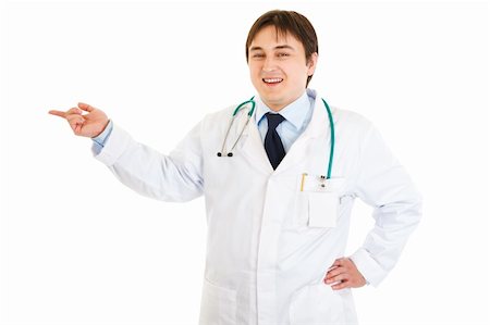 simsearch:400-04351236,k - Smiling medical doctor pointing finger at something  isolated on white Photographie de stock - Aubaine LD & Abonnement, Code: 400-04294426