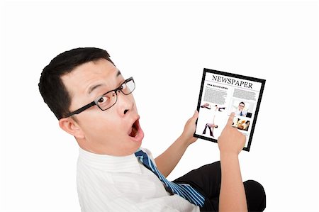 Businessman holding a touch pad pc and surprised expression Stock Photo - Budget Royalty-Free & Subscription, Code: 400-04294492