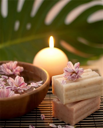 Aromatherapy. Two scrub soap and flowers floating in a water. Stock Photo - Budget Royalty-Free & Subscription, Code: 400-04295096