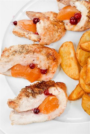 raw chicken dishes - Roast chicken meat with apricot and potato closeup Stock Photo - Budget Royalty-Free & Subscription, Code: 400-04295229