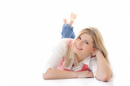 simsearch:400-05881632,k - young casual smiling woman lying on the floor isolated on white background Stock Photo - Budget Royalty-Free & Subscription, Code: 400-04295611