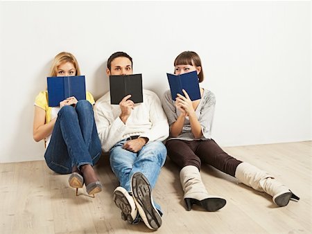 Three kidding students with books - one man and two women Stock Photo - Budget Royalty-Free & Subscription, Code: 400-04295708