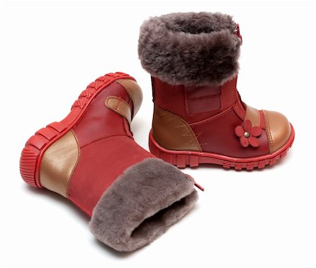 simsearch:400-04939110,k - Red baby boots with fur on white background Photographie de stock - Aubaine LD & Abonnement, Code: 400-04295725