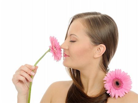 simsearch:400-04881818,k - Beautiful woman with pure healthy skin and long hair smelling 2 pink flowers. isolated on white background Fotografie stock - Microstock e Abbonamento, Codice: 400-04295915