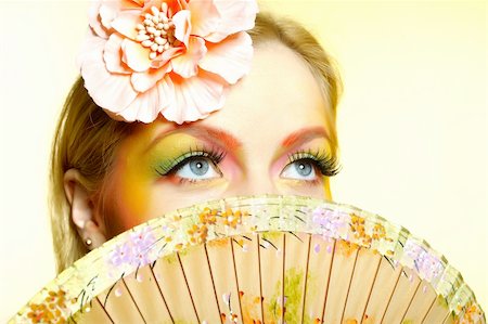 simsearch:400-04590632,k - Close-up portrait of summer fashion creative eye make-up in yellow and green tones Stock Photo - Budget Royalty-Free & Subscription, Code: 400-04295939