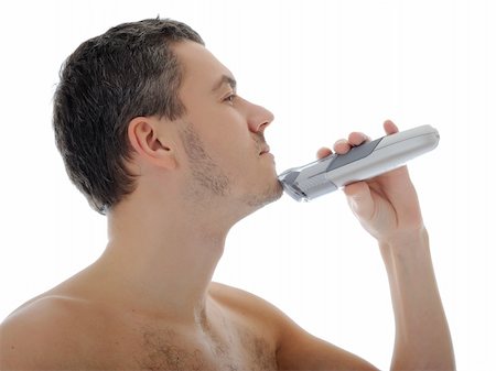 simsearch:400-04594366,k - Young handsome man shaving in the morning . isolated on white background Photographie de stock - Aubaine LD & Abonnement, Code: 400-04296040