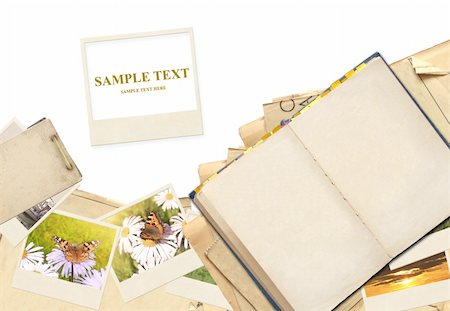 Frame with old paper and photos. Objects isolated over white Stock Photo - Budget Royalty-Free & Subscription, Code: 400-04296187