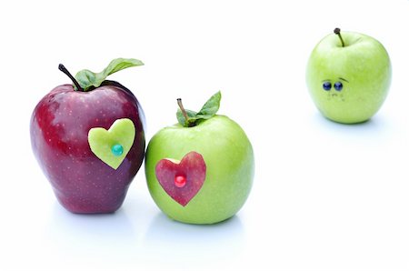 A couple of apples lovers embrace in front of lonely apple Stock Photo - Budget Royalty-Free & Subscription, Code: 400-04296378