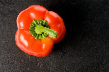 red pepper on black slate background Foto de stock - Royalty-Free Super Valor e Assinatura, Número: 400-04296557