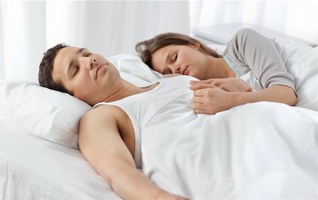 sleeping bed full body - Cute couple sleeping together on their bed at home Stock Photo - Budget Royalty-Free & Subscription, Code: 400-04296760