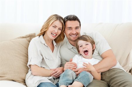 simsearch:400-04151970,k - Happy family on their sofa at home Fotografie stock - Microstock e Abbonamento, Codice: 400-04296978