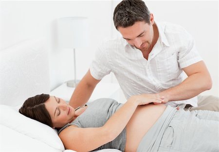 simsearch:400-04266844,k - Pregnant woman with her husband at home Stock Photo - Budget Royalty-Free & Subscription, Code: 400-04297020