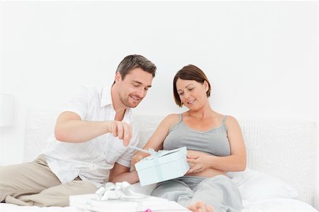 simsearch:400-04266844,k - Woman offering a gift to her wife at home Stock Photo - Budget Royalty-Free & Subscription, Code: 400-04297051