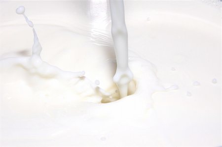 milk splashing into fresh milk with drops Stock Photo - Budget Royalty-Free & Subscription, Code: 400-04297143