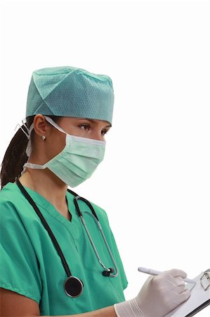 doctor with cap and mask - Image of a young female doctor sitting and taking down notes on a clipboard, a specific attitude for an anaesthesiologist monitoring a patient during a surgical intervention. Stock Photo - Budget Royalty-Free & Subscription, Code: 400-04297164