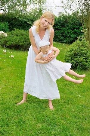simsearch:400-04795754,k - Young mother and daughter playing in meadow Stock Photo - Budget Royalty-Free & Subscription, Code: 400-04297784