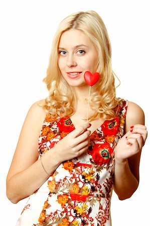 pretty blonde 13 year old girl - Close-up of a beautiful young woman with a red heart. Isolated on a white background Stock Photo - Budget Royalty-Free & Subscription, Code: 400-04297981