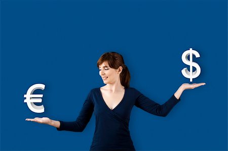 Woman making a scale with her arms and checking Euro versus Dolar Stock Photo - Budget Royalty-Free & Subscription, Code: 400-04298020