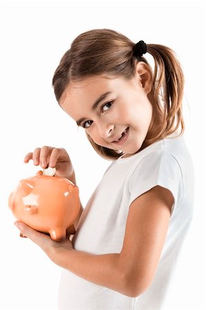 Little girl holding a piggy-bank and inserting a one euro coin Stock Photo - Budget Royalty-Free & Subscription, Code: 400-04298070