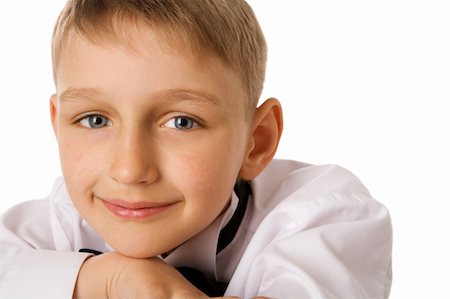 Happy seven years boy staring at you isolated Stockbilder - Microstock & Abonnement, Bildnummer: 400-04298094