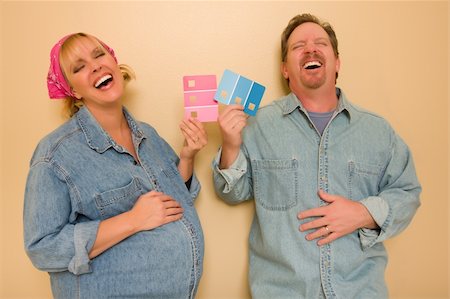 Laughing Man and Pregnant Woman Deciding on Pink or Blue Wall Paint with Swatches in Hand. Stock Photo - Budget Royalty-Free & Subscription, Code: 400-04298129