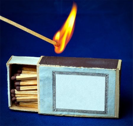 Burning match and boxes of matches Stock Photo - Budget Royalty-Free & Subscription, Code: 400-04298251