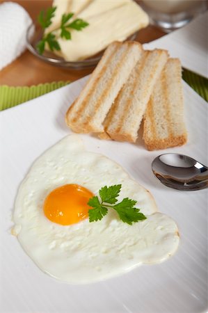 fried egg and pepper - Delicious sunny side egg with roasted toast for breakfast Stock Photo - Budget Royalty-Free & Subscription, Code: 400-04298526