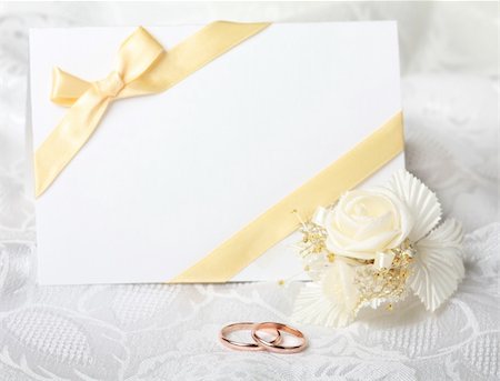 petal on stone - Wedding rings and wedding invitation with bow Stock Photo - Budget Royalty-Free & Subscription, Code: 400-04298671