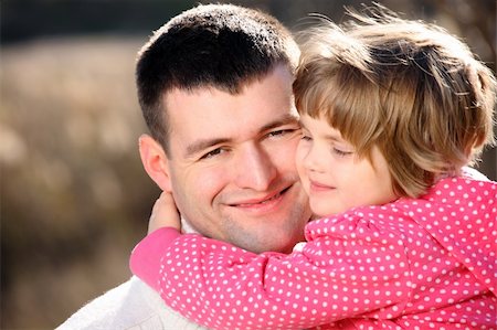 simsearch:400-07715953,k - A portrait of a proud father with his baby girl hugging in the park Stock Photo - Budget Royalty-Free & Subscription, Code: 400-04298732